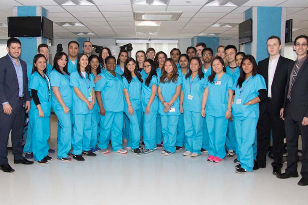 The outstanding medical and health team at Downtown Brooklyn Rehabilitation and Nursing Center is posing for a photograph.