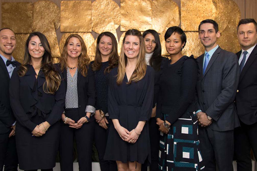 The Downtown Brooklyn Rehabilitation and Nursing Team is posing for a picture and dressed in formal wear.